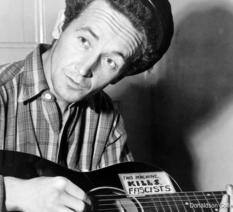 Screenshot 2025-10-17 at 08-55-27 The Story Behind Woody Guthrie's This Machine Kills Fascists Guitar Woody Guthrie : this machine kills fascists