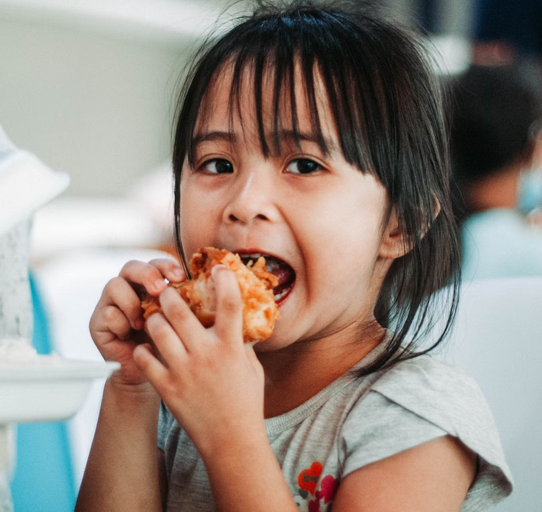 Screenshot 2025-10-22 at 08-50-46 Girl biting a good by table at daytime photo – Free School lunch Image on Unsplash