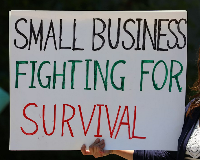 Screenshot 2025-11-26 at 09-09-04 Woman in black cardigan holding happy birthday signage photo – Free Small business Image on Unsplash