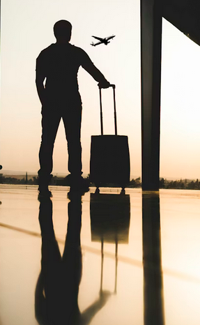 Screenshot 2025-12-11 at 19-51-37 Silhouette of man holding luggage inside airport photo – Free Travel Image on Unsplash